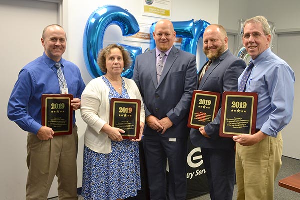 Program Manager Mike Boughton (center) recognized several community members for their contributions to the Lycoming reentry program. From left, Brad Shoemaker, Prison Warden; Nancy Butts, President Judge; John Stahl, Deputy Chief of Adult Probation; and Jack McKernan, County Commissioner.